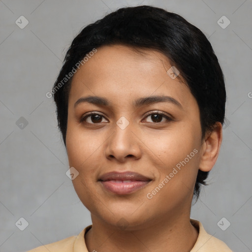 Joyful latino young-adult female with short  black hair and brown eyes