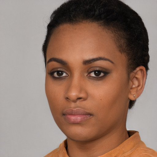 Neutral black young-adult female with short  black hair and brown eyes