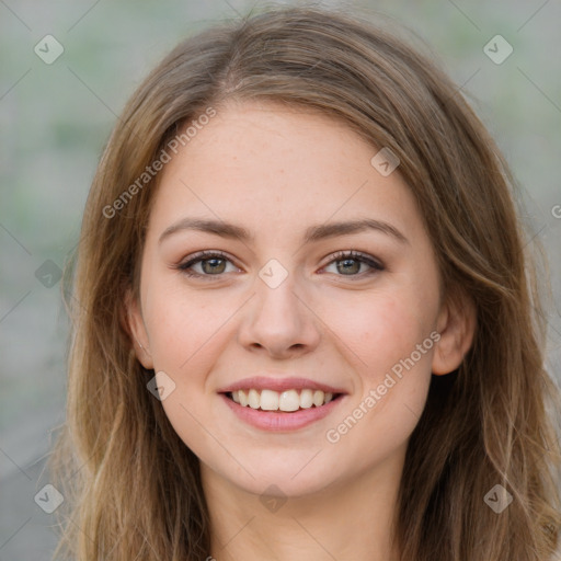 Joyful white young-adult female with long  brown hair and green eyes