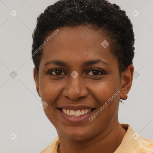 Joyful black young-adult female with short  brown hair and brown eyes