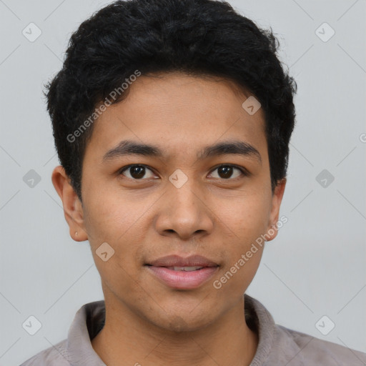 Joyful asian young-adult male with short  black hair and brown eyes