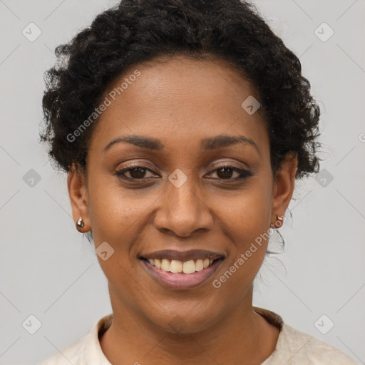 Joyful black young-adult female with short  brown hair and brown eyes