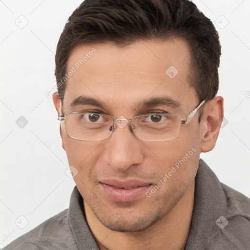 Joyful white adult male with short  brown hair and brown eyes