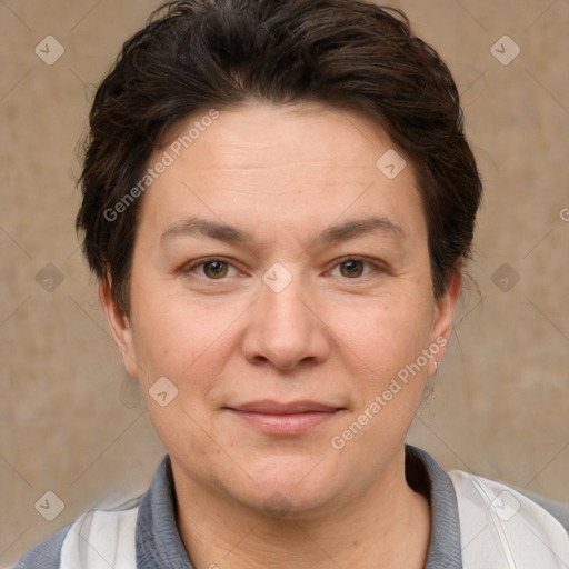 Joyful white adult female with short  brown hair and brown eyes