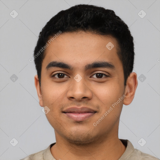 Joyful latino young-adult male with short  black hair and brown eyes