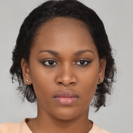 Neutral black young-adult female with medium  black hair and brown eyes
