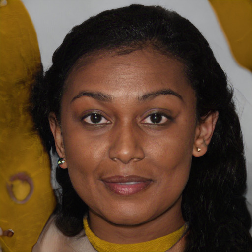Joyful black young-adult female with long  brown hair and brown eyes