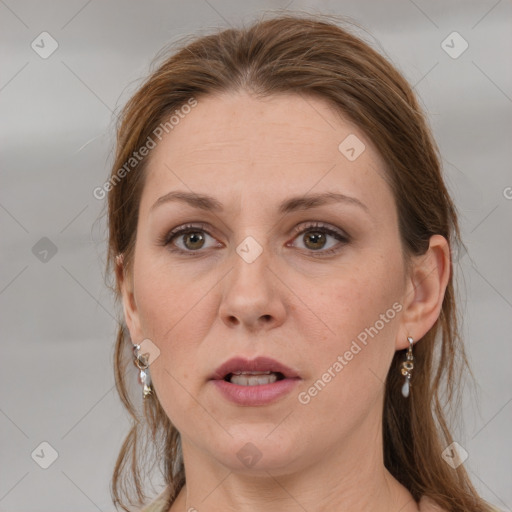 Joyful white adult female with medium  brown hair and grey eyes