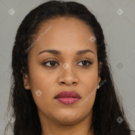 Joyful black young-adult female with long  brown hair and brown eyes