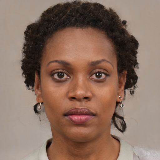 Neutral black young-adult female with short  brown hair and brown eyes