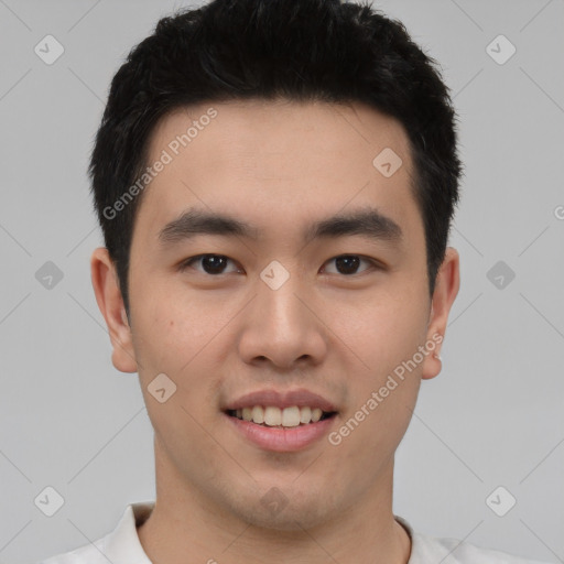 Joyful white young-adult male with short  black hair and brown eyes