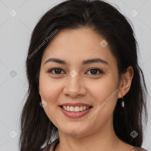 Joyful asian young-adult female with long  brown hair and brown eyes