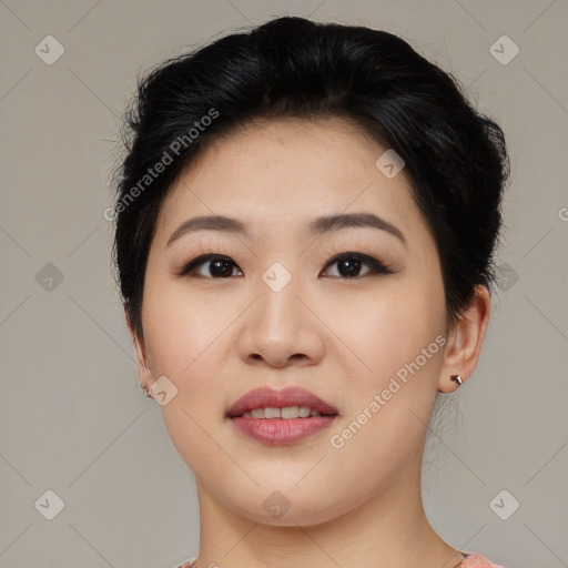 Joyful asian young-adult female with medium  black hair and brown eyes