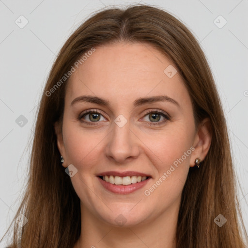 Joyful white adult female with long  brown hair and grey eyes