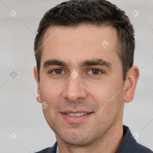 Joyful white young-adult male with short  brown hair and brown eyes