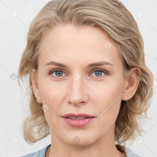 Joyful white young-adult female with medium  brown hair and blue eyes