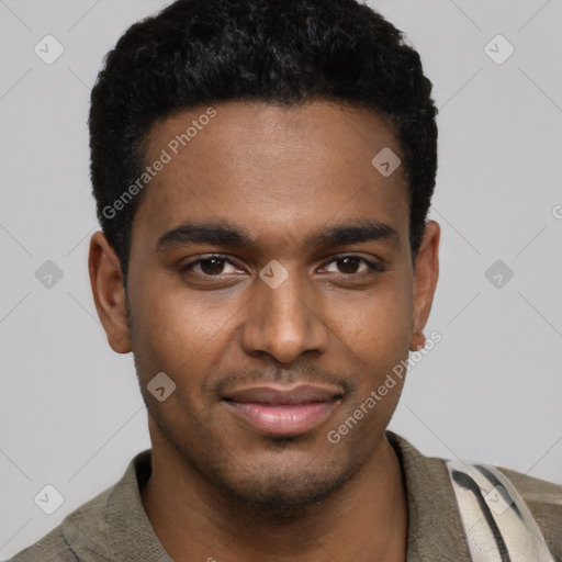 Joyful black young-adult male with short  black hair and brown eyes