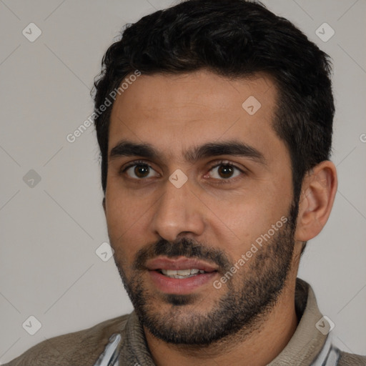 Joyful white young-adult male with short  black hair and brown eyes