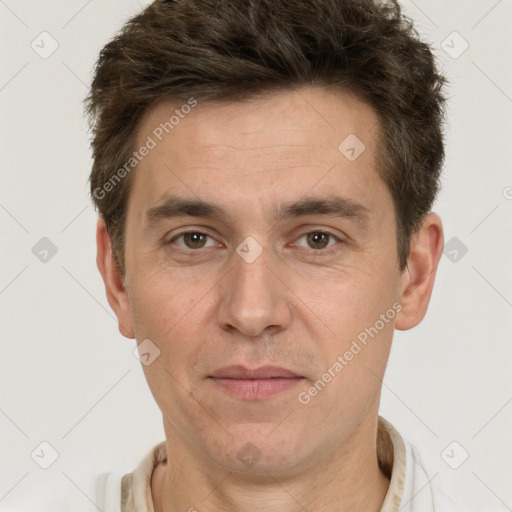 Joyful white adult male with short  brown hair and brown eyes