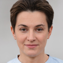 Joyful white adult female with short  brown hair and brown eyes