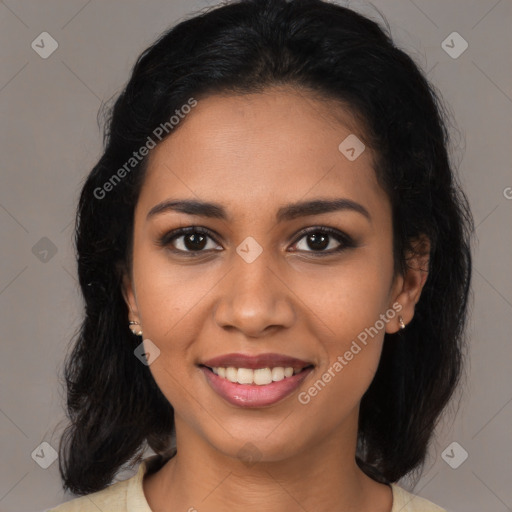 Joyful latino young-adult female with medium  brown hair and brown eyes