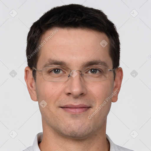 Joyful white adult male with short  brown hair and brown eyes