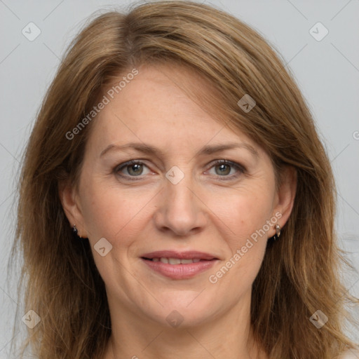 Joyful white adult female with long  brown hair and brown eyes