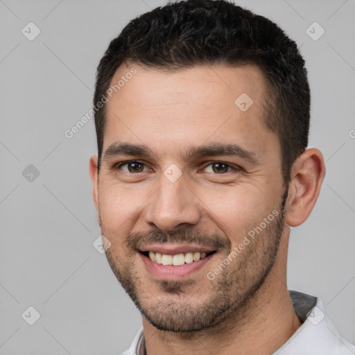 Joyful white young-adult male with short  brown hair and brown eyes