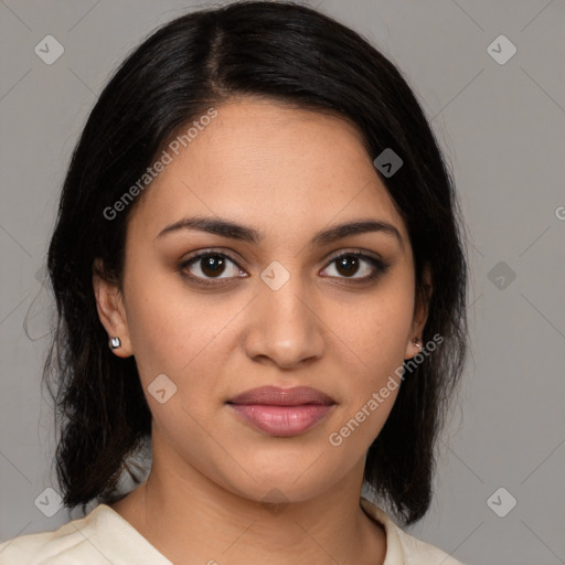 Joyful latino young-adult female with medium  brown hair and brown eyes