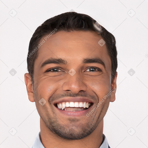 Joyful white young-adult male with short  black hair and brown eyes