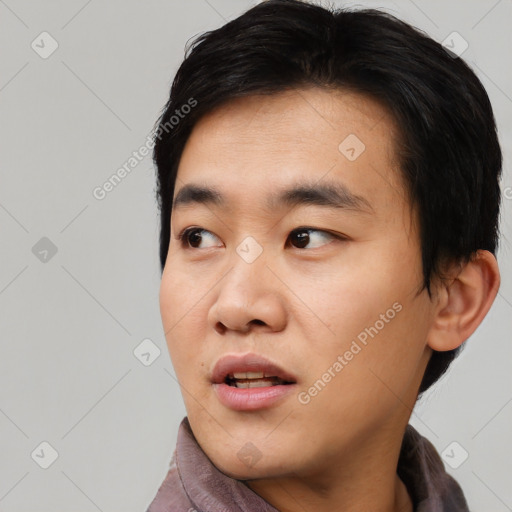 Neutral asian young-adult male with short  black hair and brown eyes