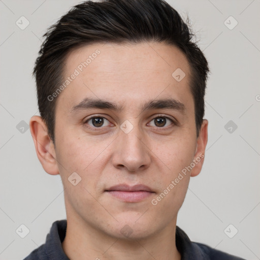 Joyful white young-adult male with short  brown hair and brown eyes