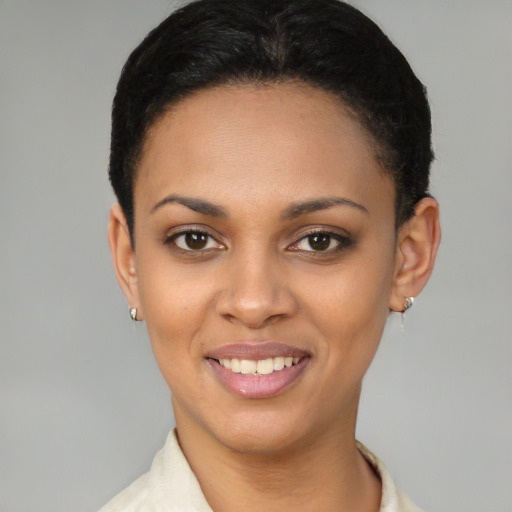 Joyful latino young-adult female with short  brown hair and brown eyes