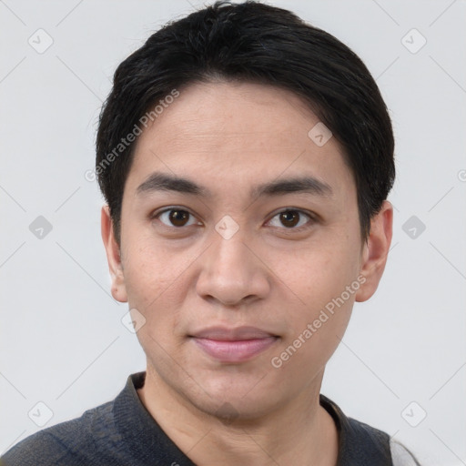 Joyful white young-adult male with short  black hair and brown eyes