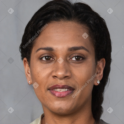 Joyful latino adult female with medium  brown hair and brown eyes