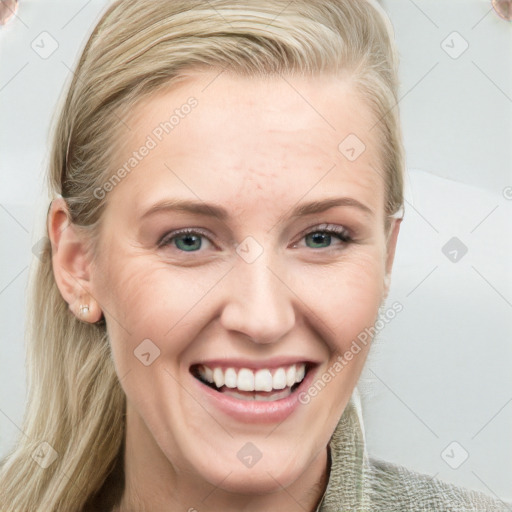 Joyful white young-adult female with medium  brown hair and blue eyes