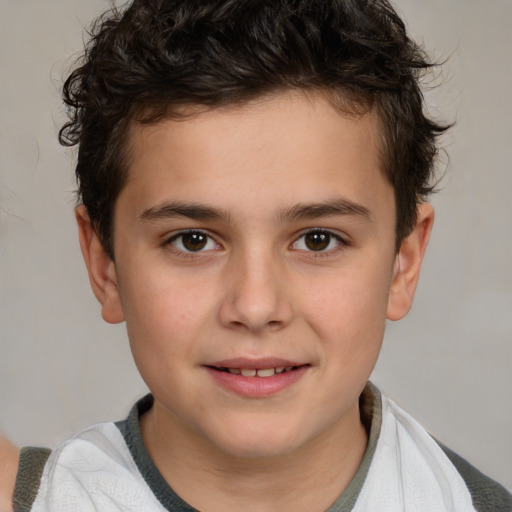 Joyful white child male with short  brown hair and brown eyes