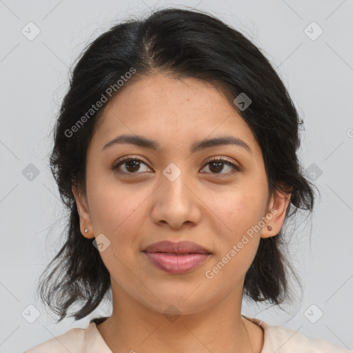 Joyful latino young-adult female with medium  brown hair and brown eyes