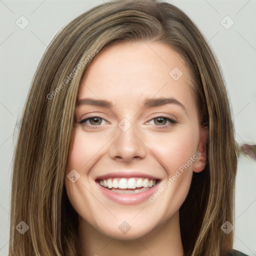 Joyful white young-adult female with long  brown hair and green eyes