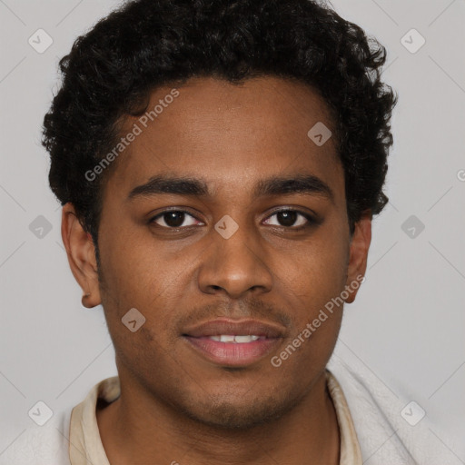 Joyful black young-adult male with short  brown hair and brown eyes