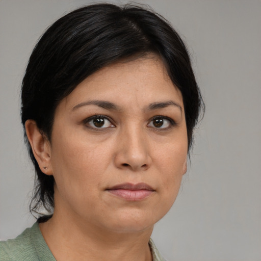 Neutral asian young-adult female with medium  brown hair and brown eyes