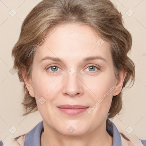 Joyful white adult female with medium  brown hair and blue eyes