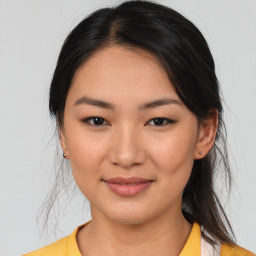 Joyful asian young-adult female with medium  brown hair and brown eyes