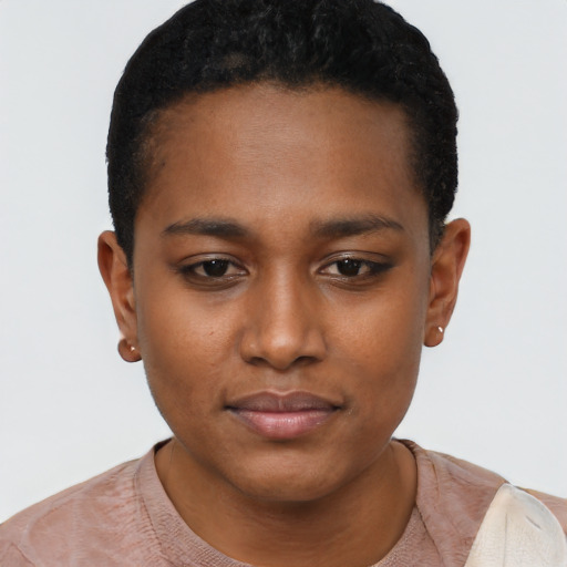 Joyful black young-adult female with short  black hair and brown eyes