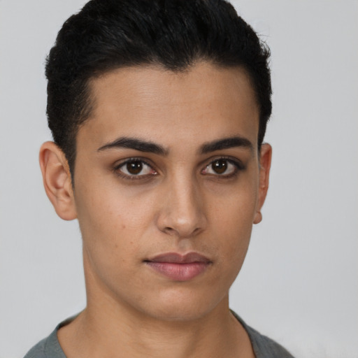 Neutral latino young-adult male with short  black hair and brown eyes