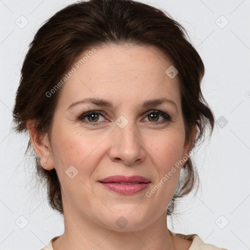 Joyful white adult female with medium  brown hair and grey eyes