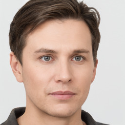 Neutral white young-adult male with short  brown hair and grey eyes