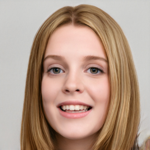 Joyful white young-adult female with long  brown hair and blue eyes