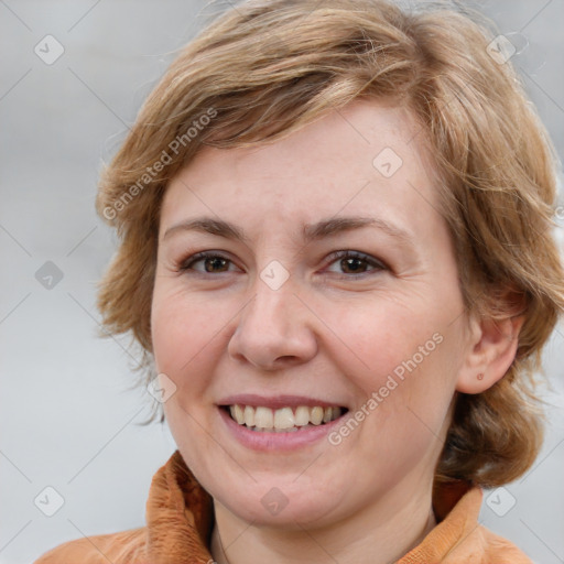 Joyful white adult female with medium  brown hair and blue eyes