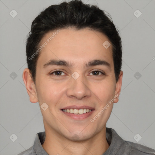 Joyful white young-adult male with short  black hair and brown eyes